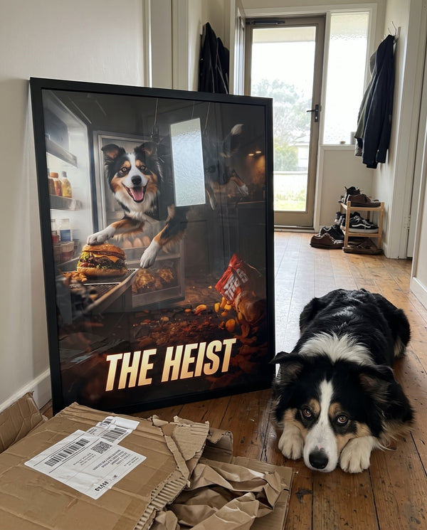 Framed Heist movie poster leaning in a hallway next to the dog it stars